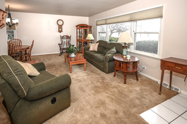 926 E Balsam Ln, Bartlett, IL 60103 - carpeted living room featuring a chandelier and baseboards