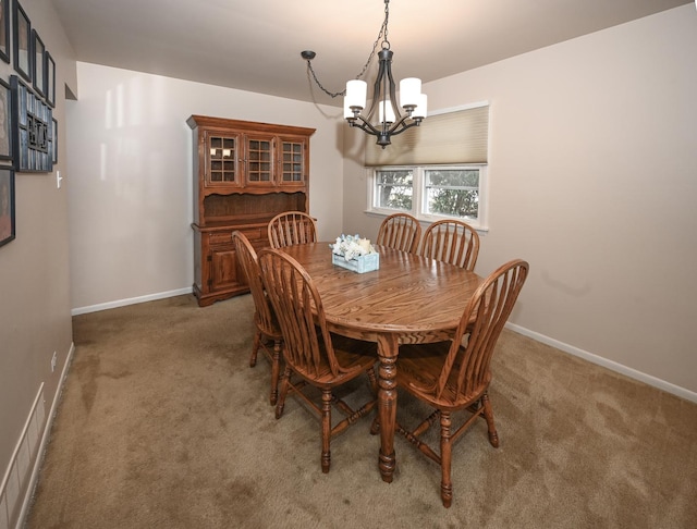 926 E Balsam Ln, Bartlett, IL 60103 - carpeted dining area featuring a chandelier and baseboards