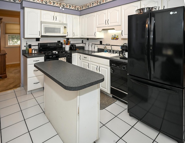 926 E Balsam Ln, Bartlett, IL 60103 - kitchen featuring black appliances, a sink, dark countertops, white cabinets, and a kitchen island