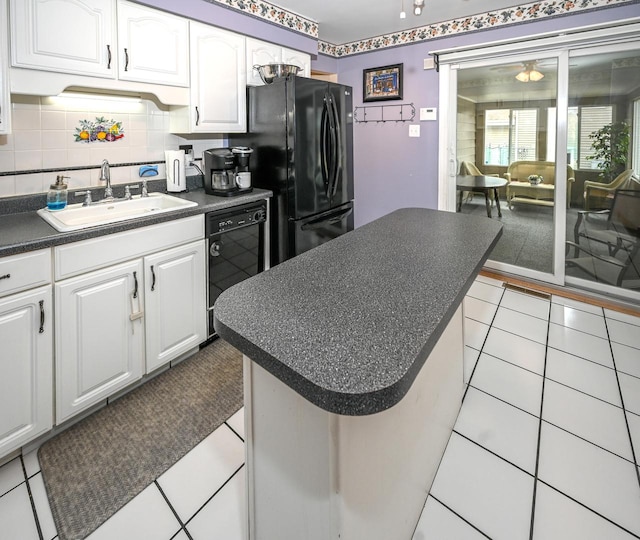 926 E Balsam Ln, Bartlett, IL 60103 - kitchen featuring a sink, dark countertops, black appliances, white cabinets, and light tile patterned floors
