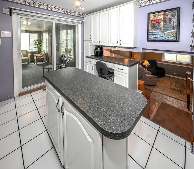 926 E Balsam Ln, Bartlett, IL 60103 - kitchen with dark countertops, white cabinets, plenty of natural light, and a center island