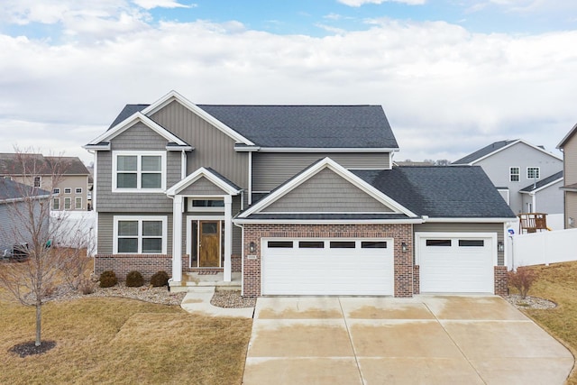 craftsman-style house featuring a garage, brick siding, fence, concrete driveway, and a front lawn