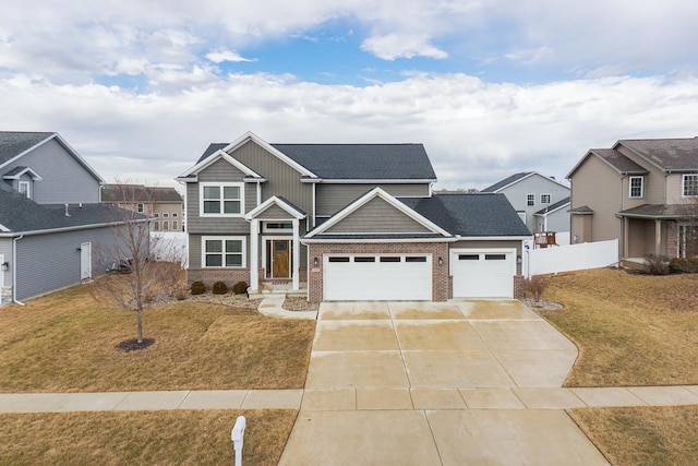 craftsman inspired home featuring a garage, concrete driveway, brick siding, and a front yard