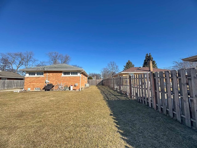 view of yard featuring a fenced backyard