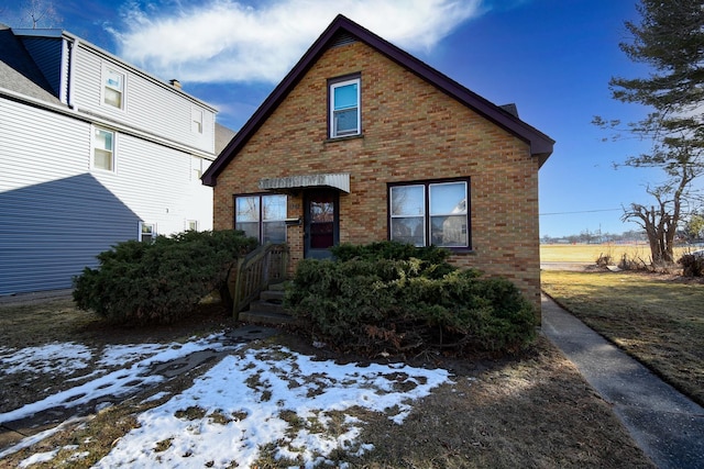 view of front of home with brick siding