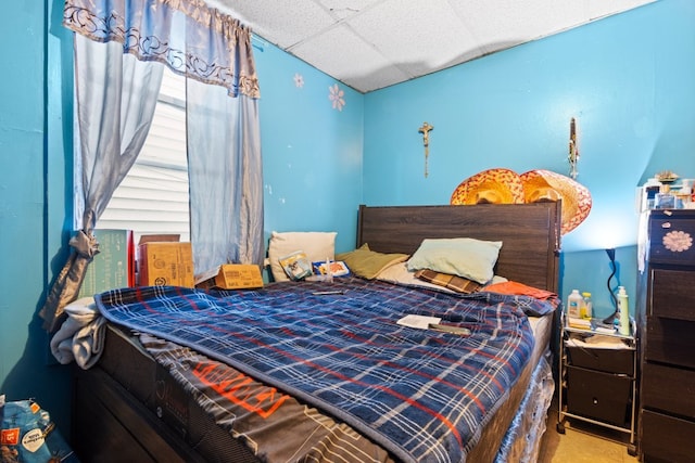 bedroom with a drop ceiling