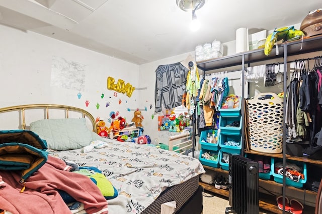 bedroom featuring radiator