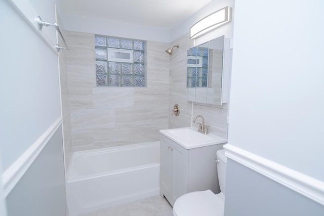 bathroom with toilet, vanity, and bathing tub / shower combination