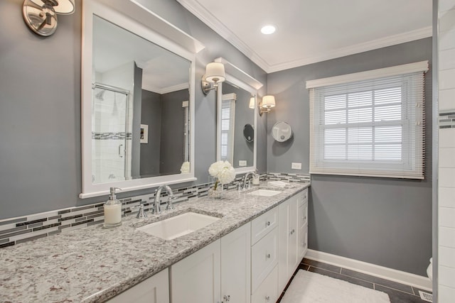 full bathroom featuring baseboards, ornamental molding, backsplash, and a sink