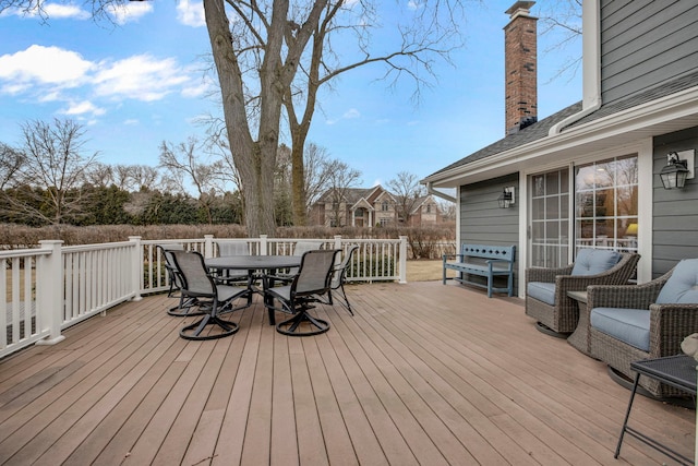 deck with outdoor dining area