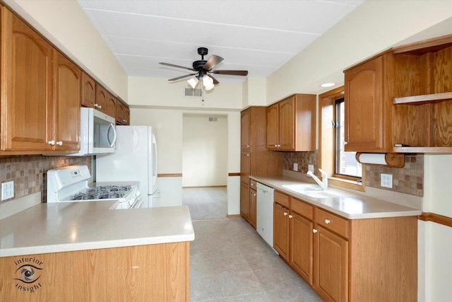 kitchen featuring white appliances, a sink, visible vents, light countertops, and open shelves