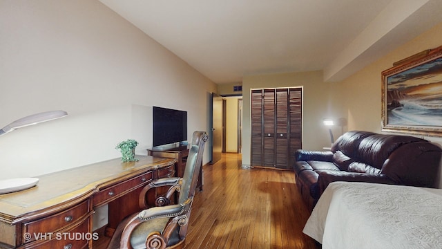 bedroom featuring wood finished floors