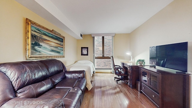 bedroom with hardwood / wood-style flooring