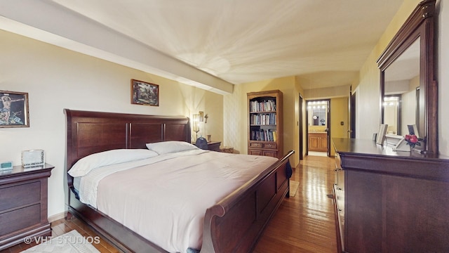 bedroom with wood finished floors