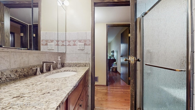 bathroom featuring visible vents, vanity, and wood finished floors