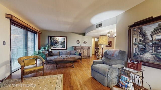 living room featuring wood finished floors and visible vents