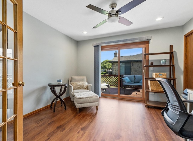 interior space with recessed lighting, wood finished floors, a ceiling fan, and baseboards