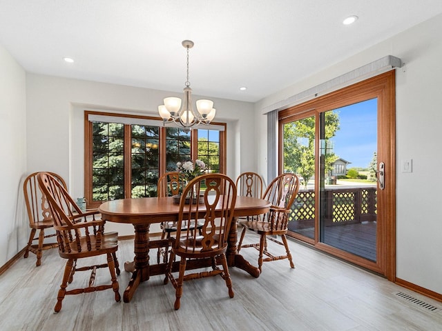 dining space featuring an inviting chandelier, baseboards, visible vents, and recessed lighting