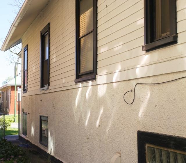 view of side of home with stucco siding