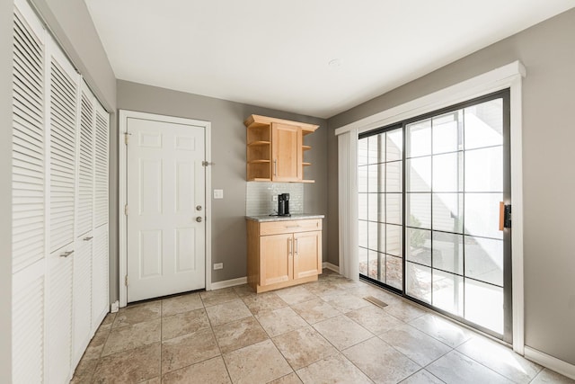 interior space with visible vents and baseboards