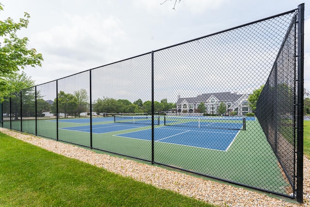 view of sport court with fence