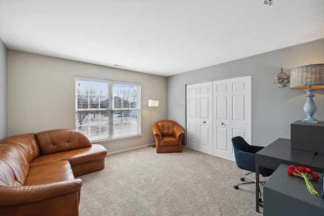 carpeted home office with baseboards