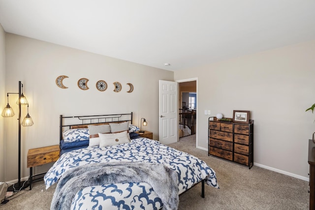 carpeted bedroom with baseboards