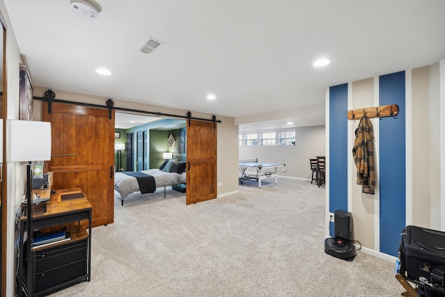 interior space with recessed lighting, light colored carpet, baseboards, and a barn door