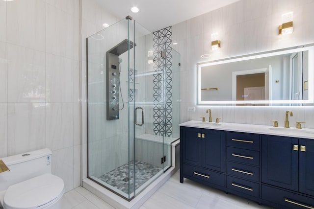 bathroom with toilet, a sink, tile walls, and a shower stall