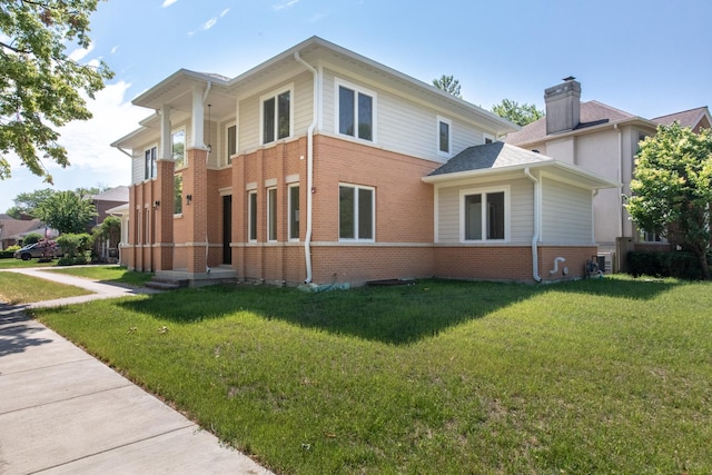 view of property exterior featuring a yard and brick siding