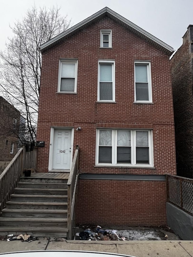 traditional-style house with brick siding