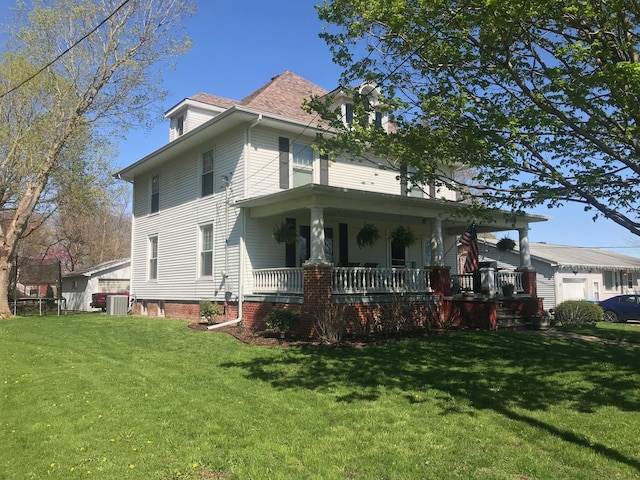 view of front of home with a porch and a front yard