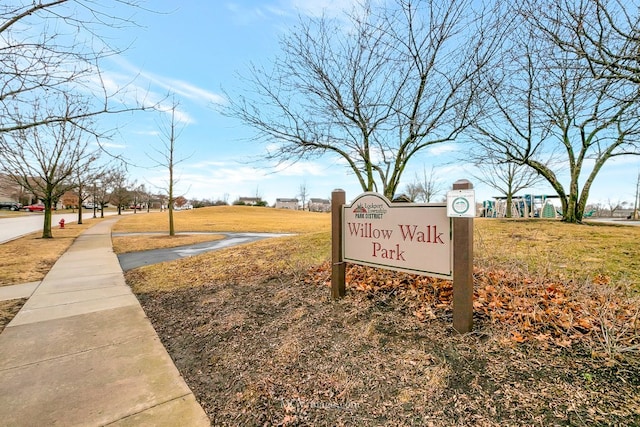 view of property's community with a yard