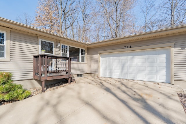 exterior space featuring an attached garage and concrete driveway