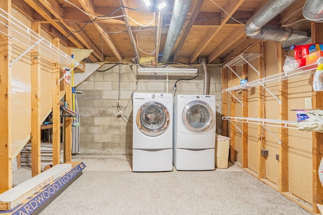 laundry room featuring washer and dryer and laundry area