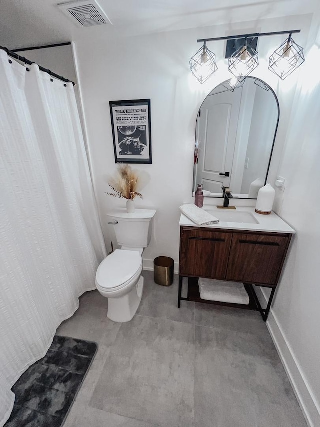 full bathroom with toilet, vanity, visible vents, and baseboards