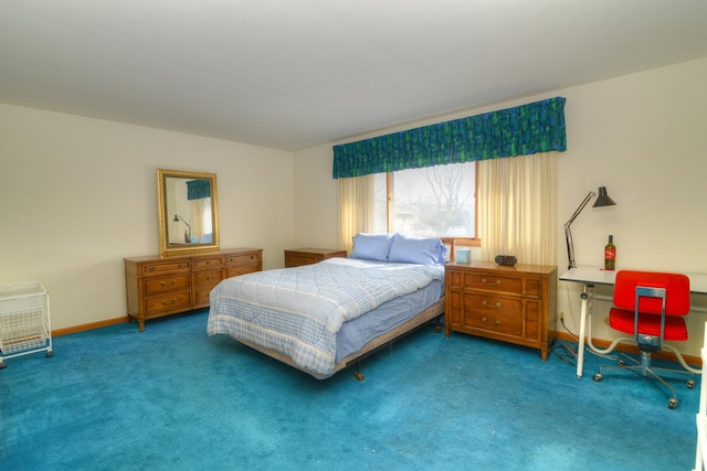 bedroom with baseboards and carpet floors