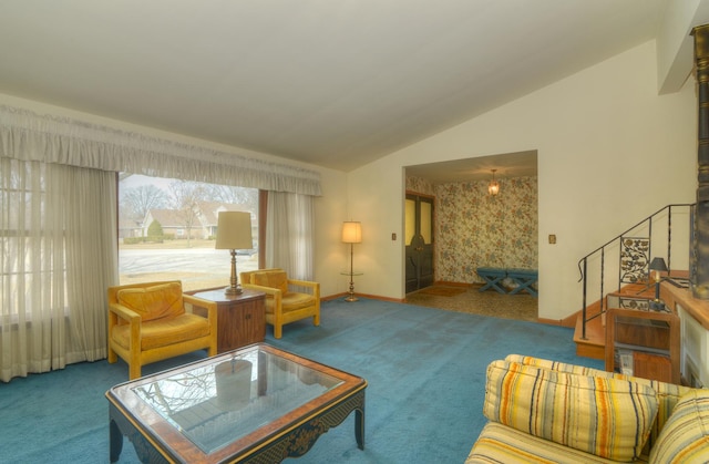 carpeted living room featuring stairway, baseboards, and lofted ceiling