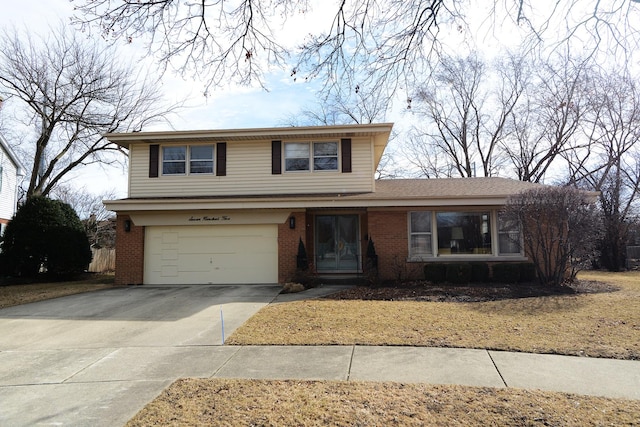 traditional-style home with brick siding, driveway, and an attached garage