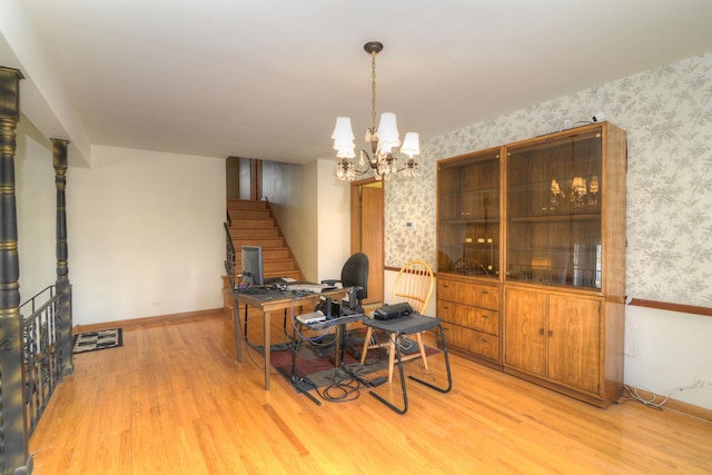 office area with a chandelier, baseboards, wallpapered walls, and light wood-style floors