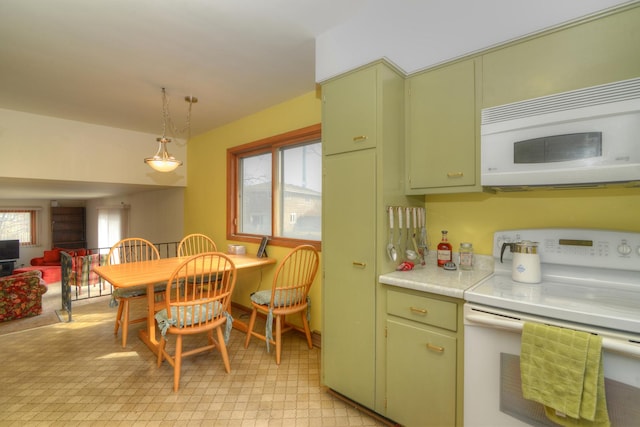 kitchen with hanging light fixtures, white appliances, light countertops, and green cabinetry