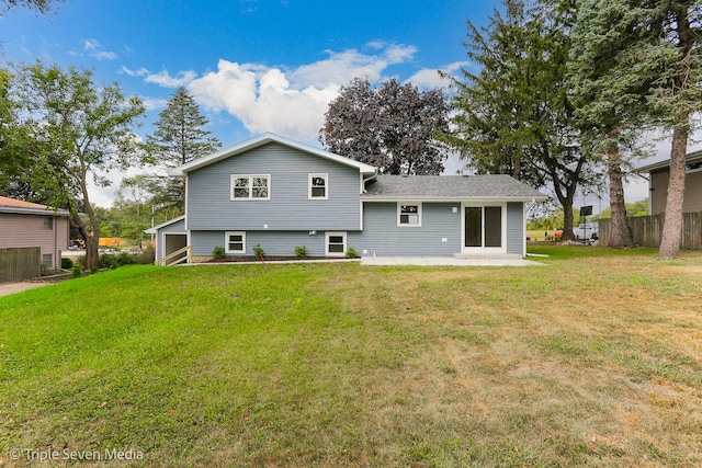 back of property with a patio area, fence, and a yard