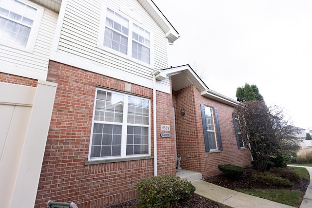 view of home's exterior featuring brick siding