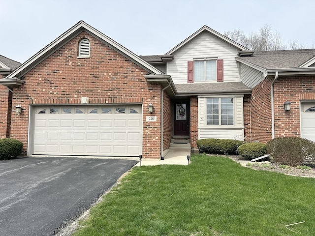 traditional-style home with roof with shingles, aphalt driveway, brick siding, and a front lawn