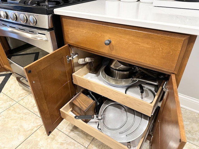 room details with brown cabinets and light countertops