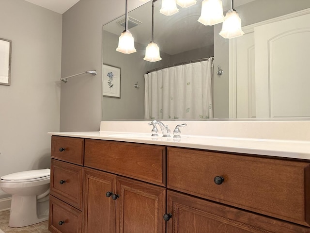 full bath with visible vents, curtained shower, toilet, vanity, and tile patterned flooring
