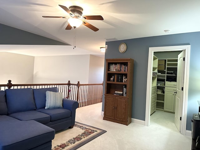 living area featuring a ceiling fan and light colored carpet