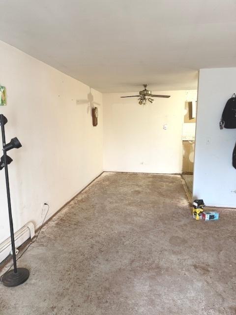 unfurnished living room with a ceiling fan