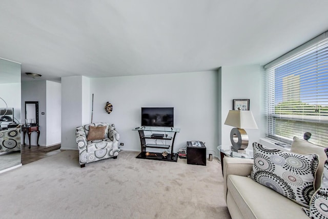 living room with carpet floors and baseboards