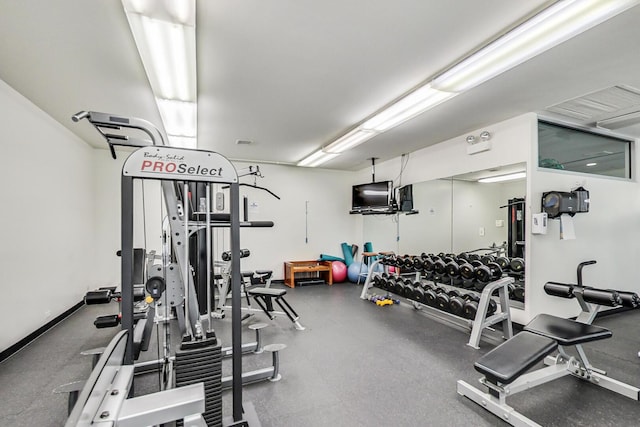 workout area featuring baseboards